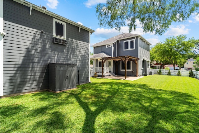 back of house with a yard, a pergola, and a patio