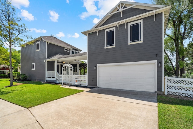 view of front of house featuring a front yard and a garage