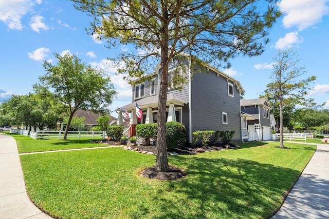 view of property exterior featuring a garage and a yard