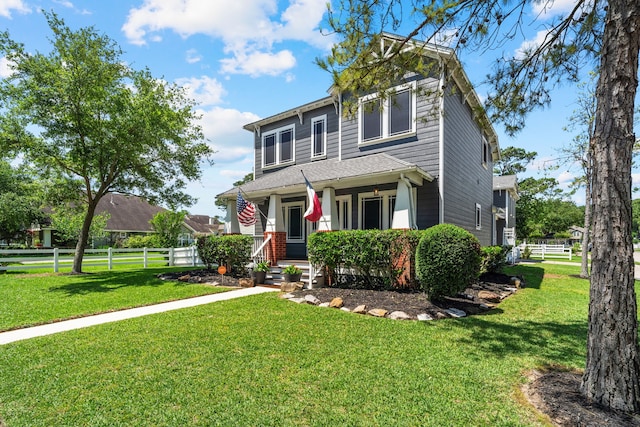 view of front facade featuring a front yard and a porch