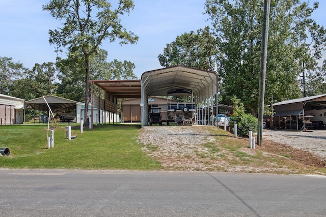 view of front of property featuring a front lawn and a carport