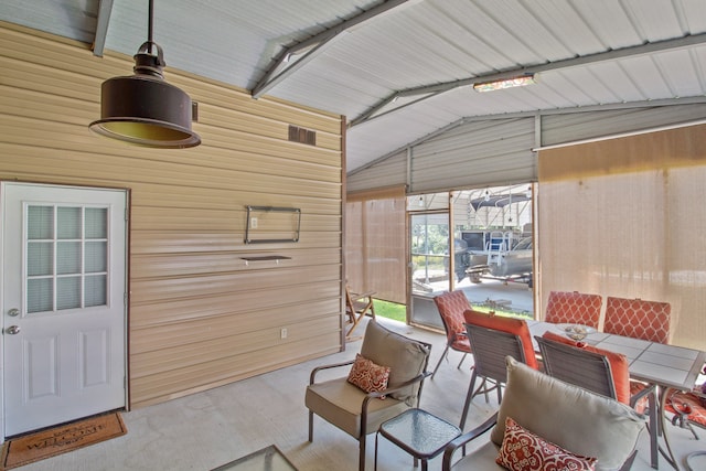 sunroom featuring lofted ceiling