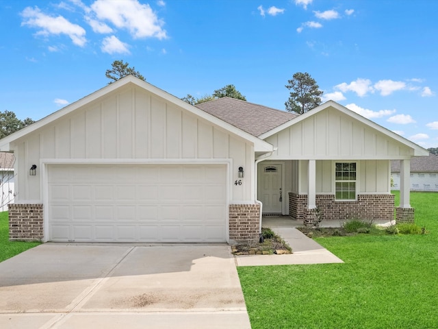 view of front of property with a garage, a porch, and a front lawn