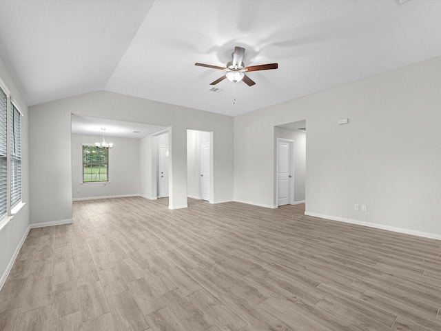 unfurnished living room with lofted ceiling, ceiling fan with notable chandelier, and light hardwood / wood-style flooring