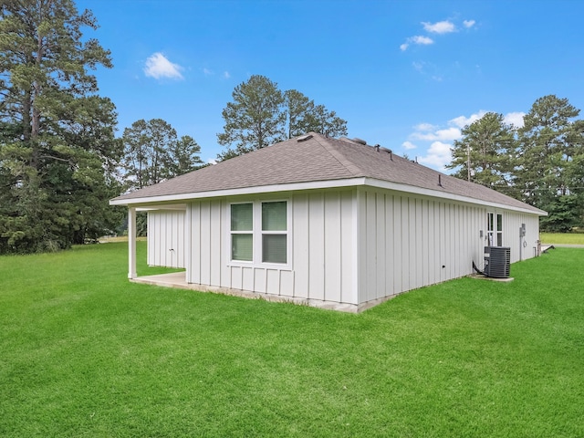 view of home's exterior featuring a lawn and central air condition unit