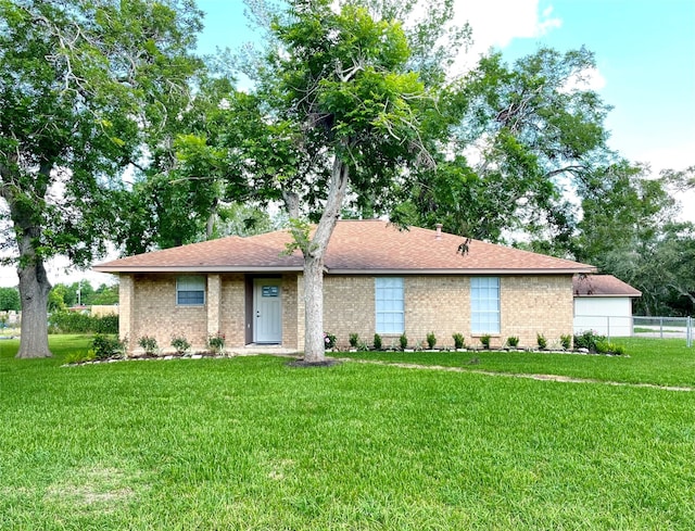 ranch-style house with a front yard