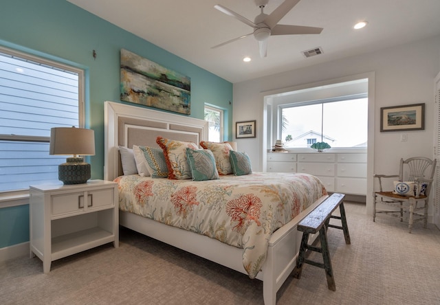 carpeted bedroom with ceiling fan