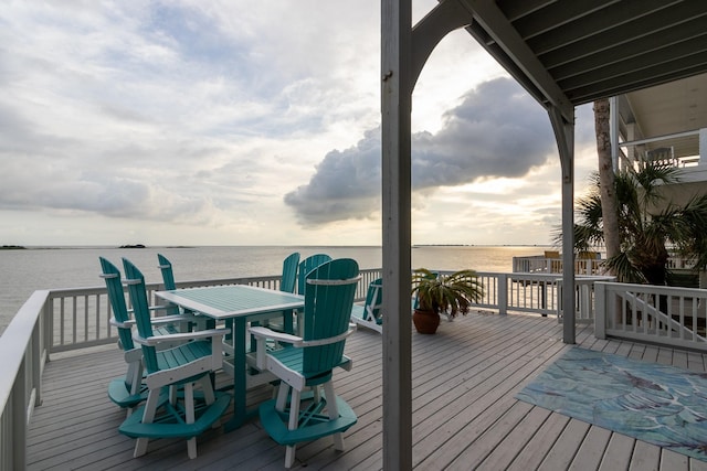 wooden deck with a water view