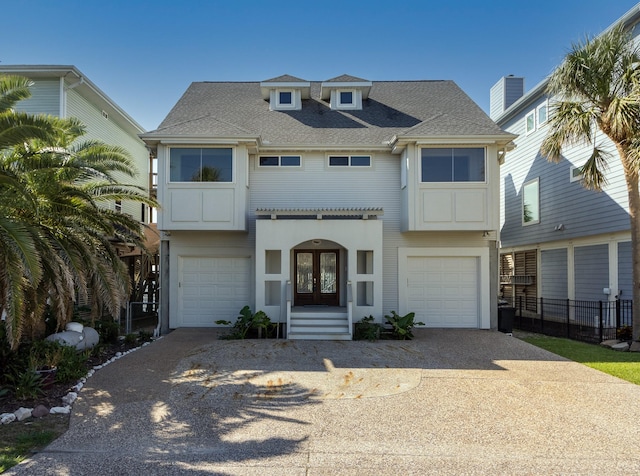 view of front facade with french doors and a garage