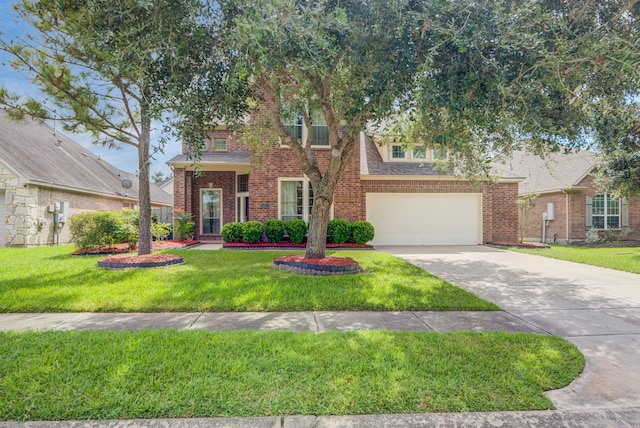 view of front of property with a garage and a front lawn