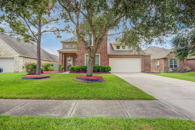 view of front of property with a garage and a front lawn