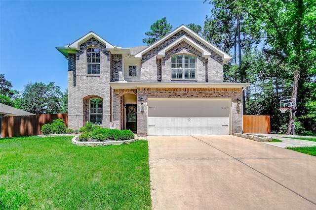 view of front of property featuring a front yard and a garage