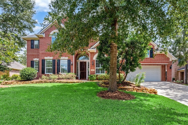 view of front facade with a garage and a front lawn