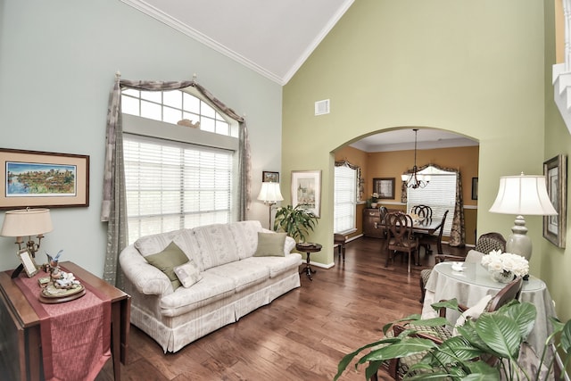 living room featuring crown molding, high vaulted ceiling, a healthy amount of sunlight, and dark hardwood / wood-style floors