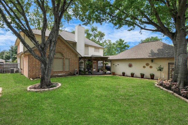 rear view of property with cooling unit, a lawn, a patio, and a pergola