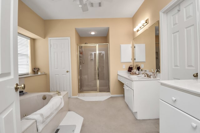 bathroom featuring separate shower and tub and vanity