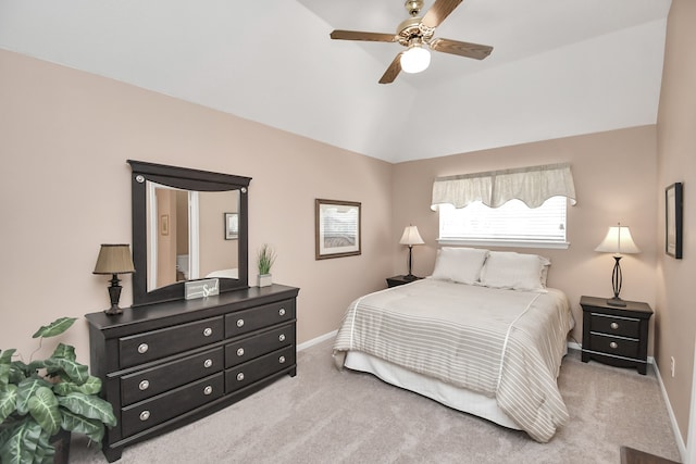 carpeted bedroom featuring ceiling fan and vaulted ceiling