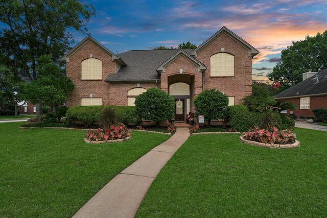 view of front property with a yard