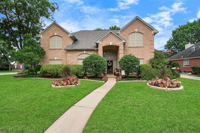 front facade featuring a front lawn