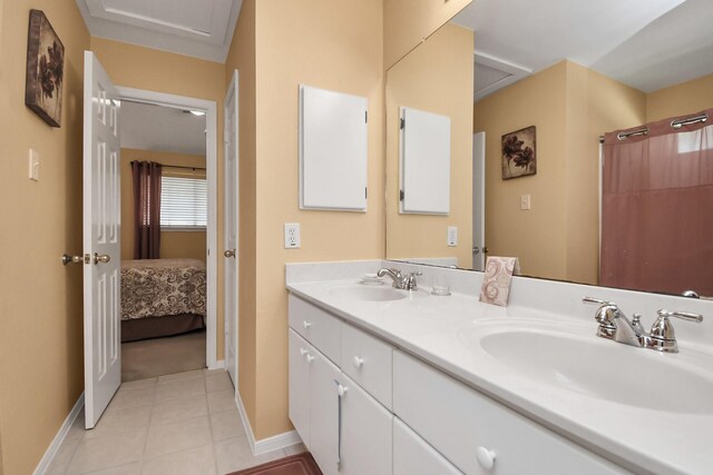 bathroom featuring tile patterned flooring and vanity