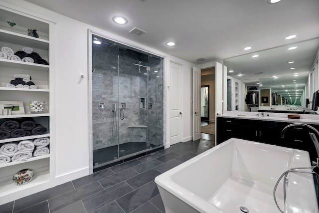 bathroom featuring vanity, separate shower and tub, and tile patterned flooring