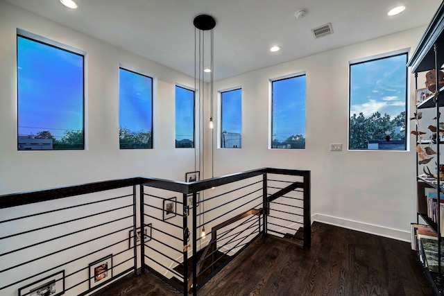 hallway featuring dark hardwood / wood-style flooring