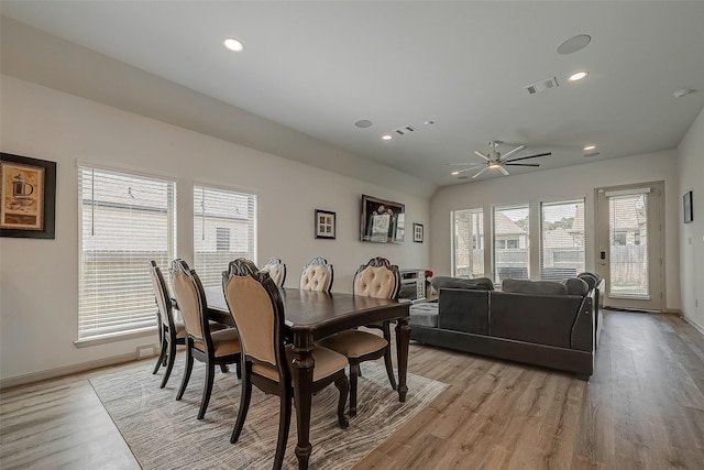 dining room featuring light wood-type flooring, baseboards, visible vents, and recessed lighting