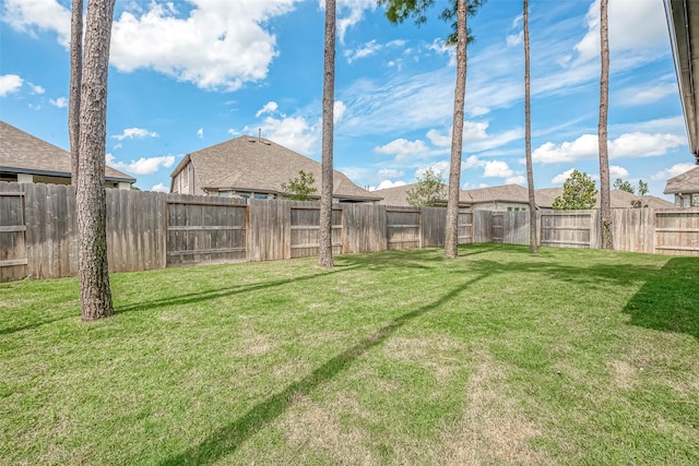 view of yard with a fenced backyard