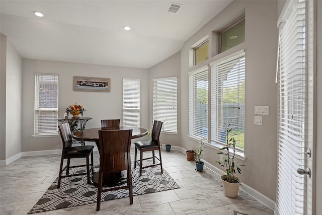 dining area with vaulted ceiling