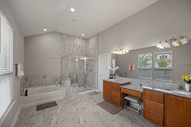 bathroom with vanity, lofted ceiling, and plus walk in shower