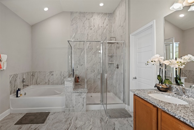 bathroom with vanity, vaulted ceiling, and shower with separate bathtub