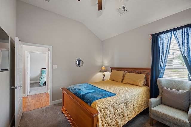 bedroom with carpet, vaulted ceiling, and ceiling fan