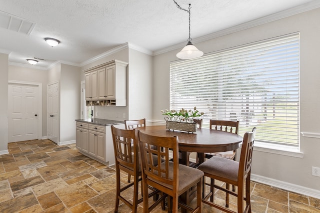 dining space with visible vents, a textured ceiling, baseboards, and stone tile flooring