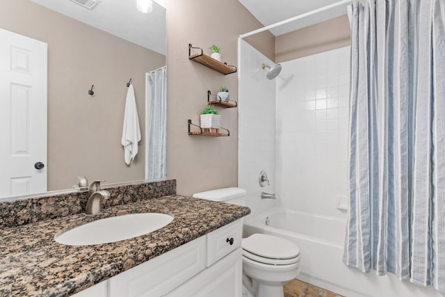 bathroom with vanity, toilet, and shower / bath combo with shower curtain