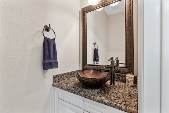 bathroom with visible vents and vanity