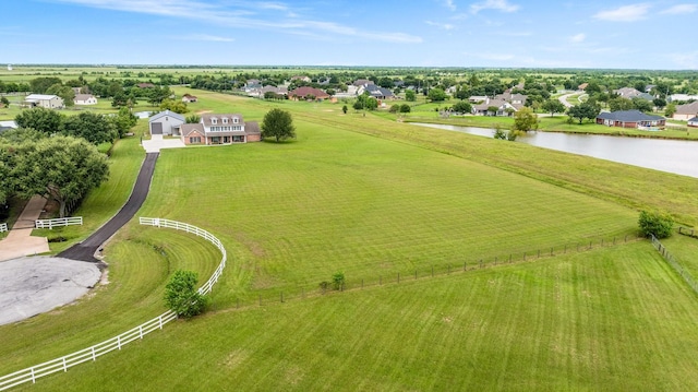 bird's eye view with a water view and a rural view