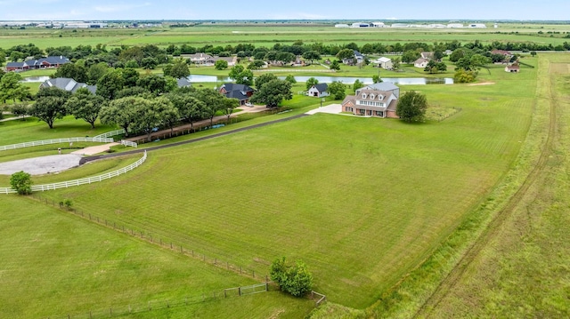 drone / aerial view with a water view and a rural view