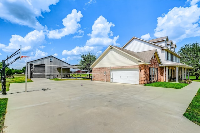 view of property exterior with a garage, a shingled roof, and brick siding