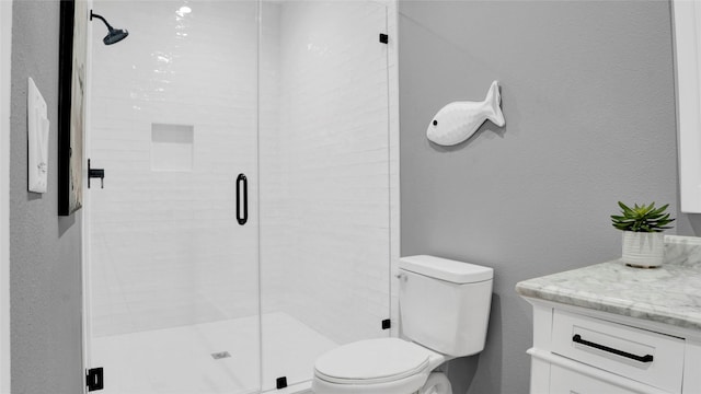 full bath with toilet, a stall shower, and a textured wall