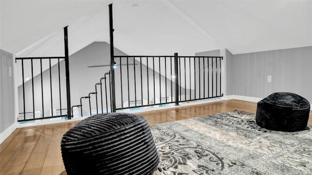 interior space featuring hardwood / wood-style floors and high vaulted ceiling