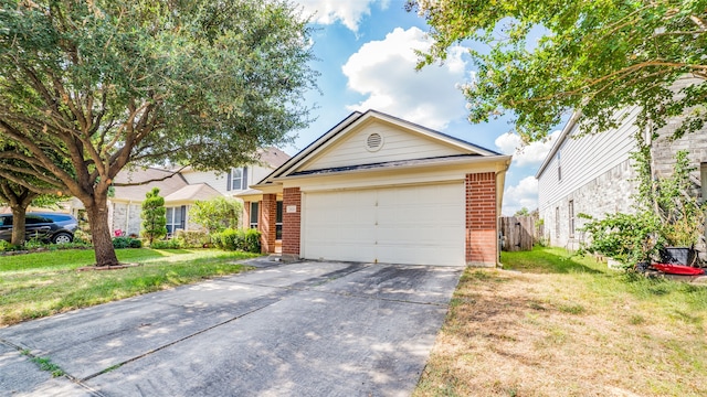 view of front of house with a garage and a front lawn