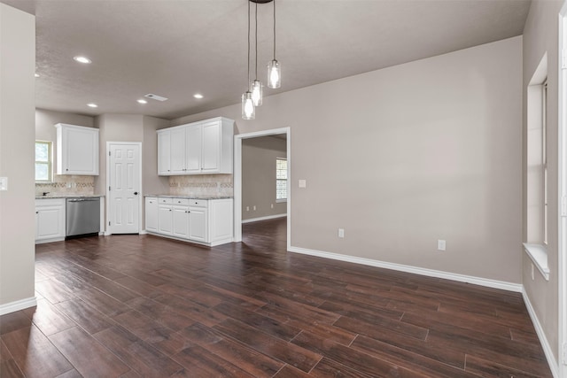 unfurnished living room featuring dark hardwood / wood-style floors