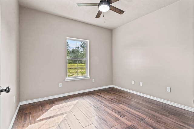 unfurnished room with ceiling fan and wood-type flooring