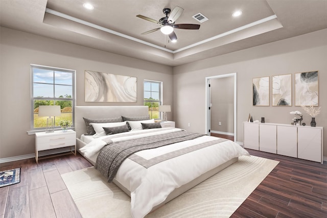 bedroom featuring ornamental molding, a raised ceiling, dark hardwood / wood-style flooring, and ceiling fan