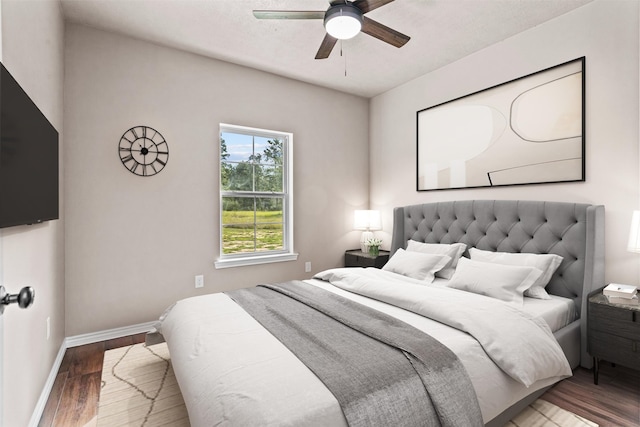 bedroom with wood-type flooring and ceiling fan