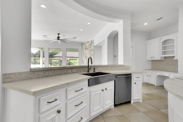 kitchen featuring stainless steel dishwasher, ceiling fan, light stone counters, and white cabinetry