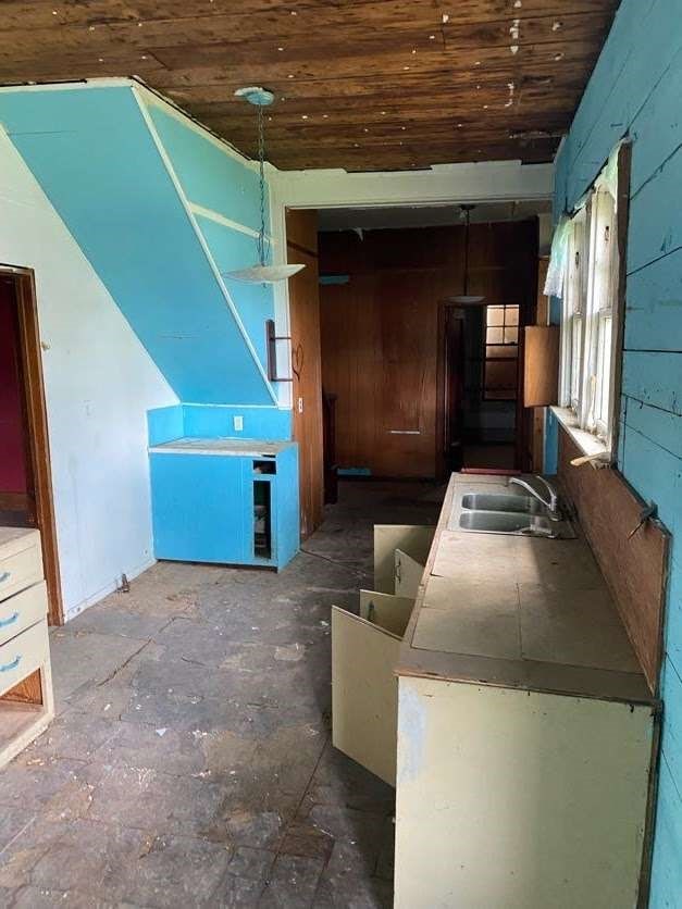 interior space with wooden ceiling and sink