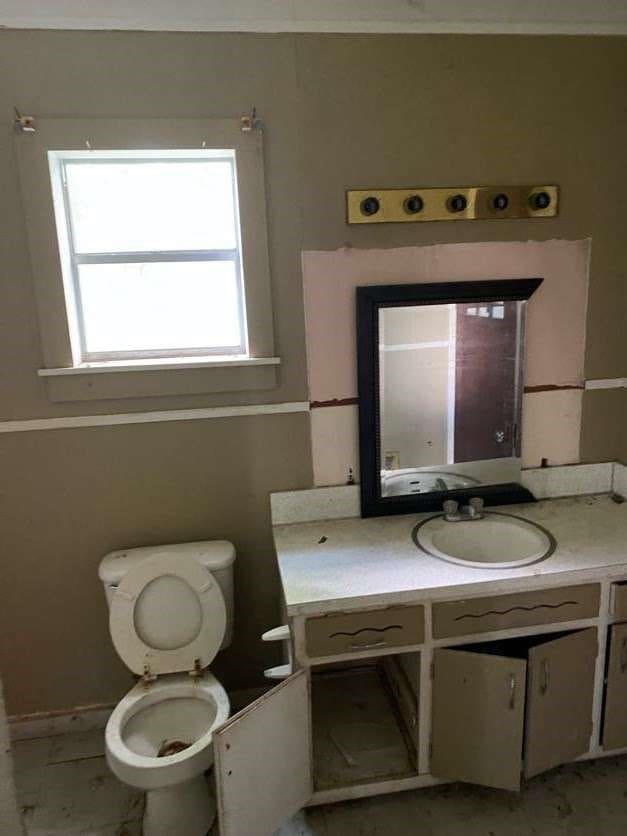 bathroom featuring vanity and toilet