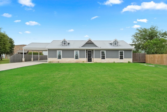 single story home featuring fence, driveway, a front lawn, a carport, and metal roof