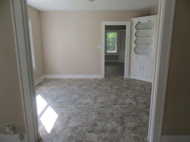 110 Spencer St, Brazoria, TX 77422 - spare room featuring baseboards and stone finish flooring
